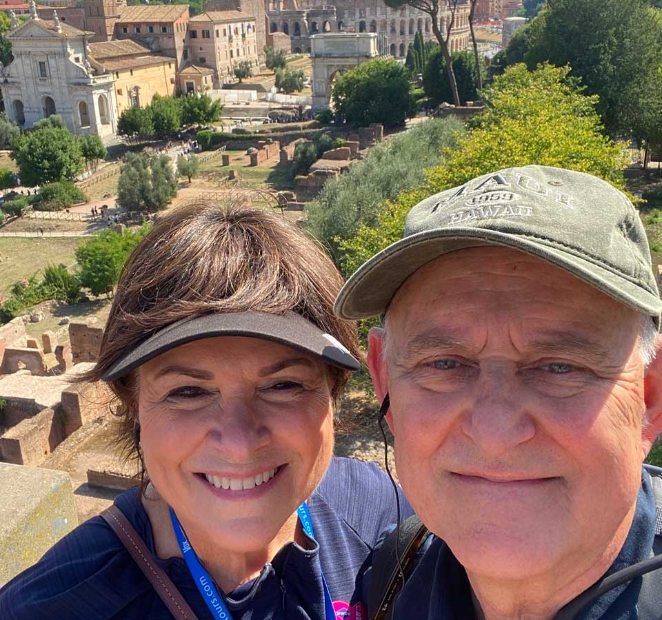 Claudia and husband with scenic background